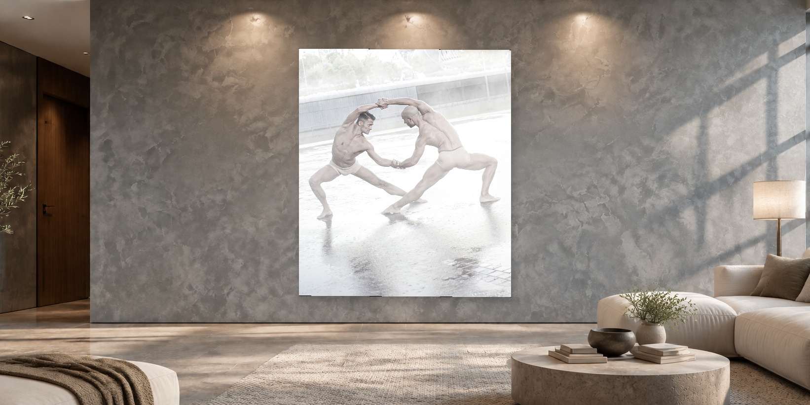 Body to Body Dancers fine art photograph by Igor Muñoz displayed on a grey living room wall above a sofa and coffee table